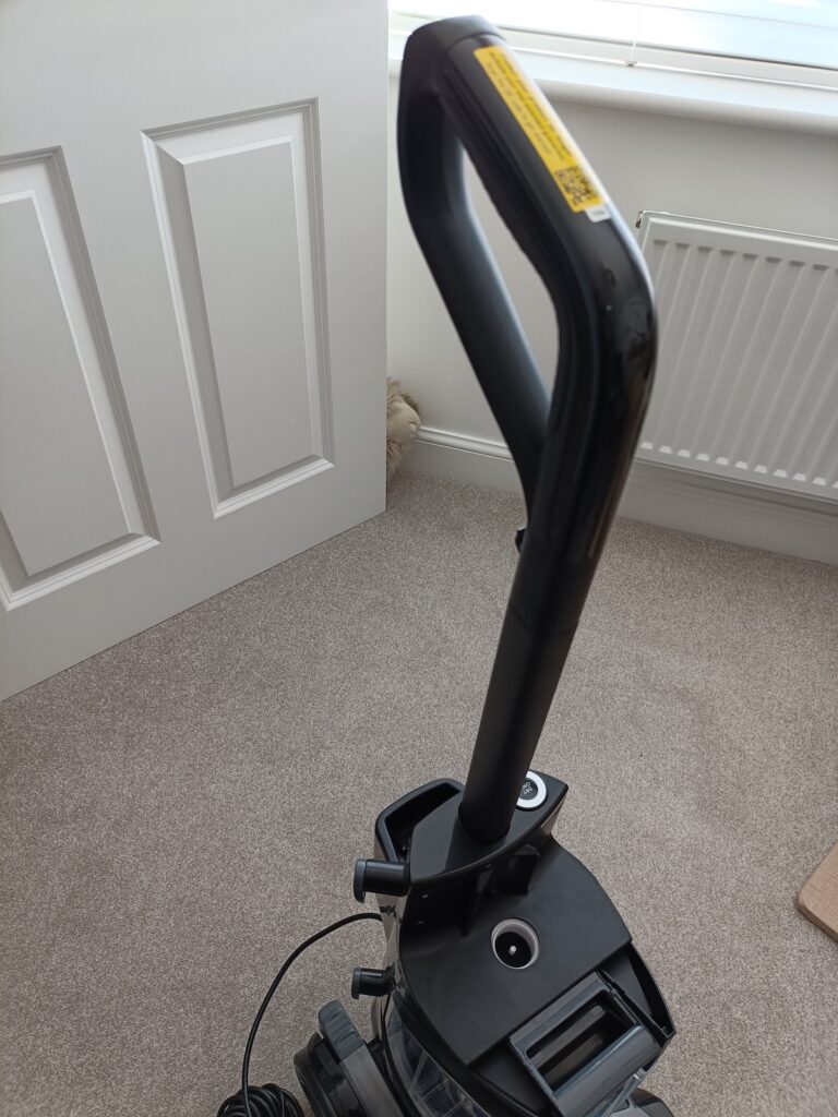 Handle slotted into the base unit