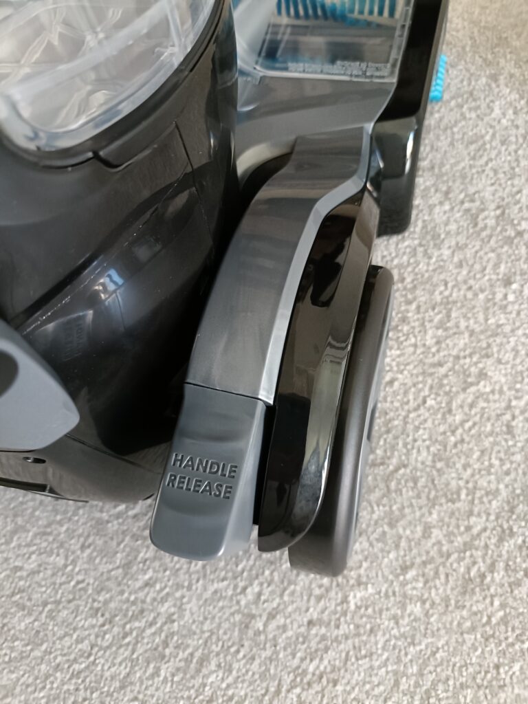 Grey pedal on right at the back makes the carpet cleaner lean, for easier sweeping motion