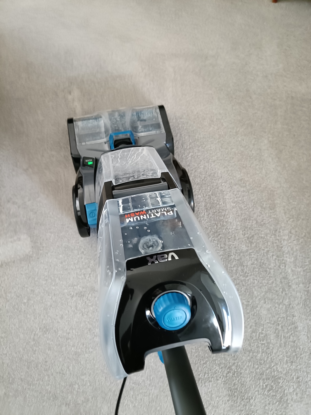 Pulling the carpet cleaner back on the dry cycle