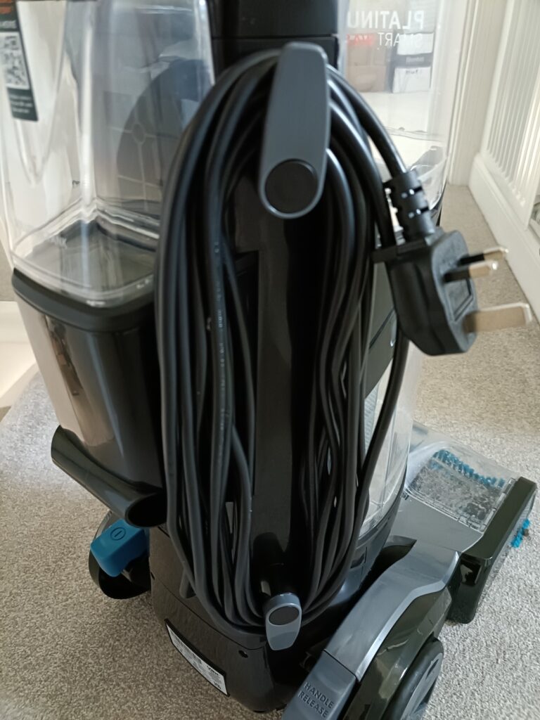 Power cord wrapped around a retainer bracket