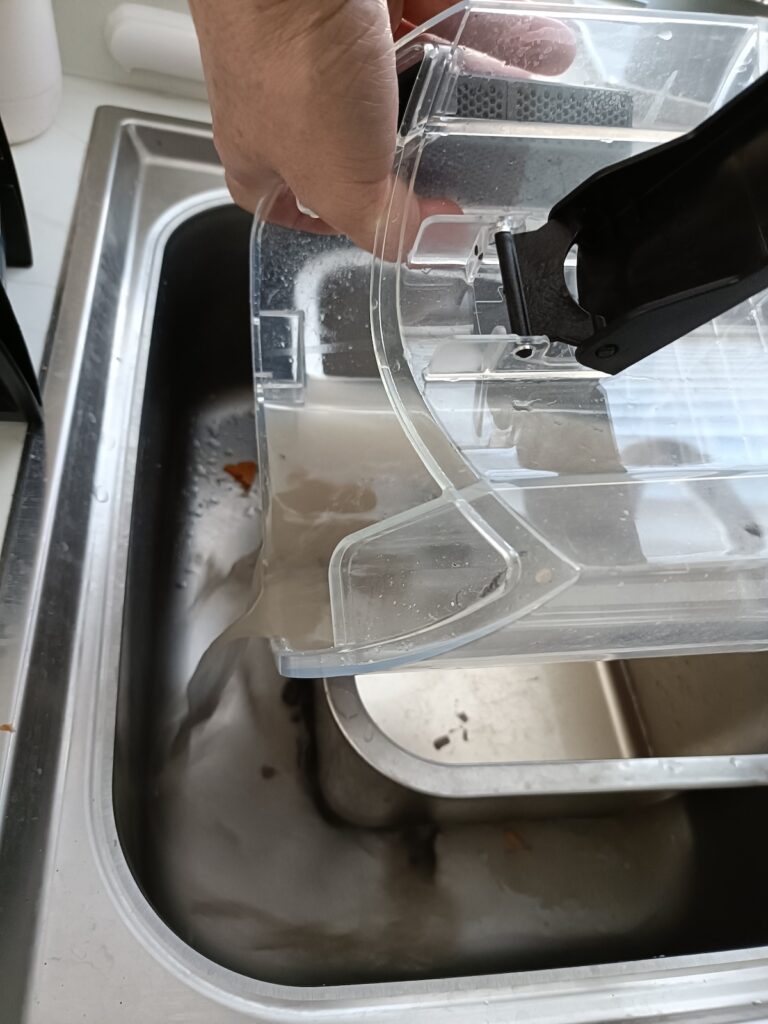 Emptying the dirty water container