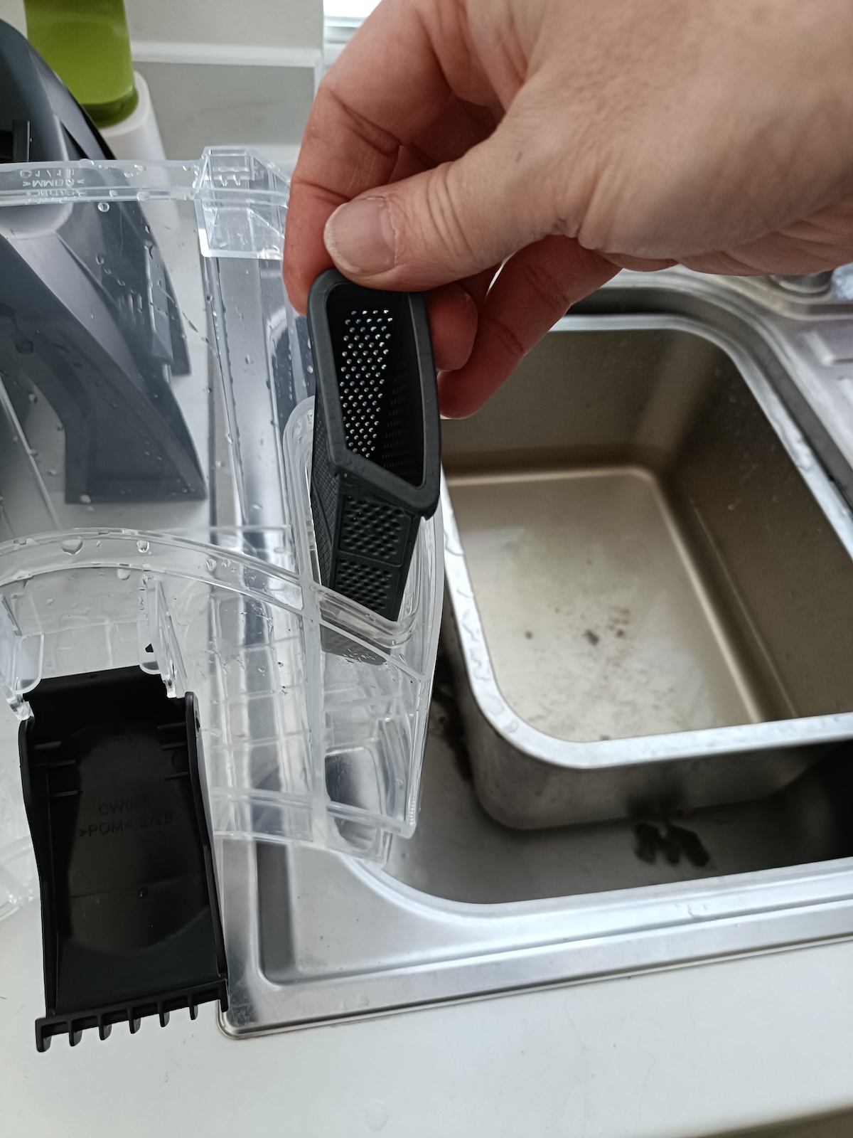 Removing the filter from the dirty water container