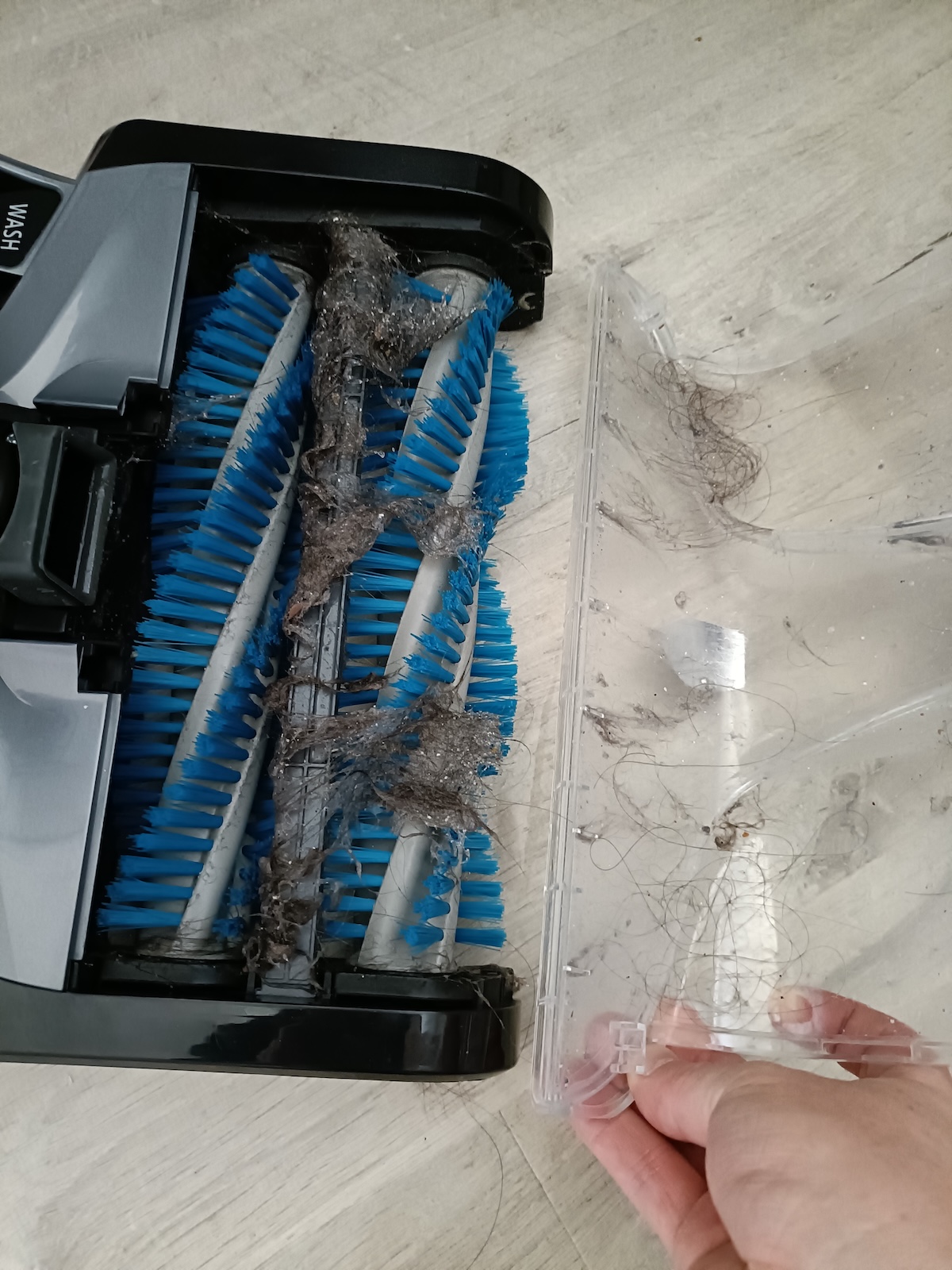Removing the front cover ready for cleaning the brushes