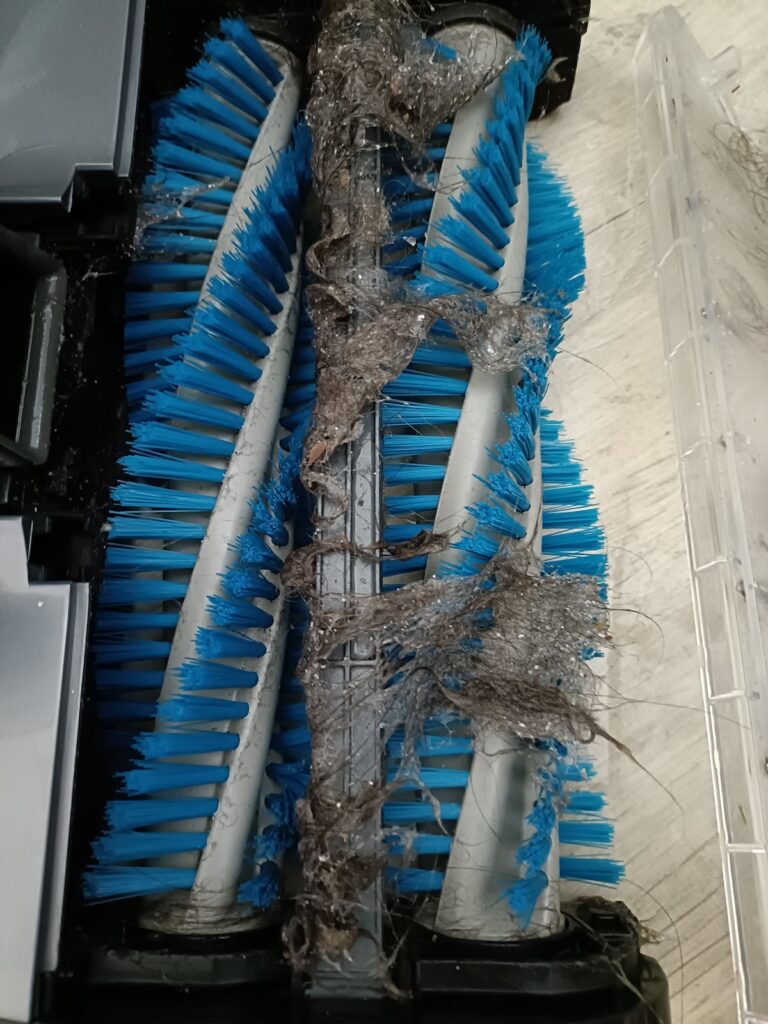 Brushes accessible at the front ready for removing fur and hair