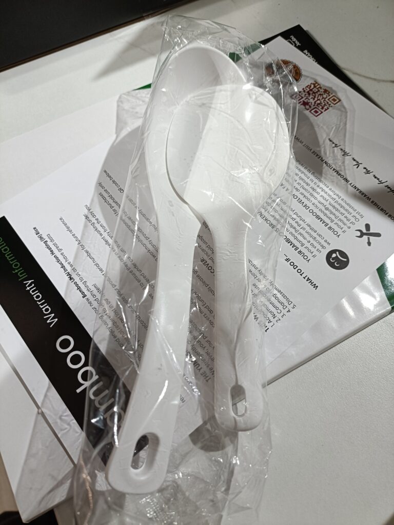 Utensils and instruction manual included with the Bamboo rice cooker